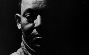 Movie still from “La Jetée” (1962), directed by Chris Marker – A black and white photo of a man's face; Close Up shot, Low angle