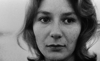 Movie still from “La Jetée” (1962), directed by Chris Marker – A black - and - white photograph of a woman's face; Close Up shot, Low angle