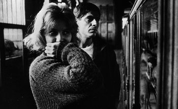 Movie still from “La Jetée” (1962), directed by Chris Marker – A man and a woman standing next to each other; Close Up shot, Over the shoulder angle