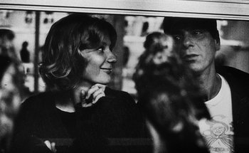 Movie still from “La Jetée” (1962), directed by Chris Marker – A man and a woman looking at each other through a window; Close Up shot, Over the shoulder angle