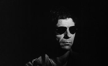Movie still from “La Jetée” (1962), directed by Chris Marker – Black and white photograph of a man wearing sunglasses; Close Up shot, Low angle