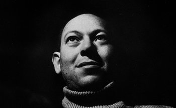 Movie still from “La Jetée” (1962), directed by Chris Marker – Black and white photograph of a man in a sweater looking up; Close Up shot, Low angle