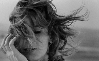 Movie still from “La Jetée” (1962), directed by Chris Marker – A person with hair flying in the wind; Close Up shot, Low angle