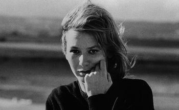 Movie still from “La Jetée” (1962), directed by Chris Marker – A black - and - white photo of a young woman with her hand on her face; Close Up shot, Low angle