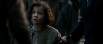 Movie still from “La Vie En Rose” (2007), directed by Olivier Dahan – A young girl is looking up at the sky; Close Up shot, Over the shoulder angle