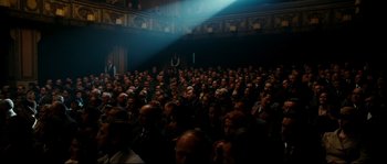 Movie still from “La Vie En Rose” (2007), directed by Olivier Dahan – A crowd of people sitting in front of an audience; Wide shot, High angle