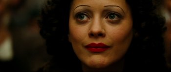 Movie still from “La Vie En Rose” (2007), directed by Olivier Dahan – A woman's face with red lipstick; Extreme Close Up shot, Overhead angle
