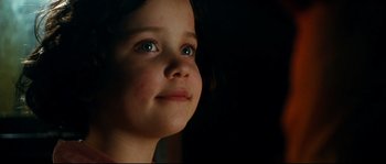 Movie still from “La Vie En Rose” (2007), directed by Olivier Dahan – A little girl with blue eyes looking up at the sky; Close Up shot, Low angle