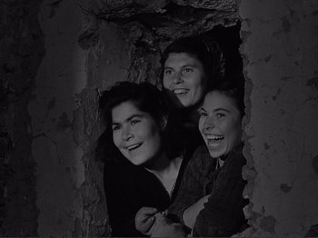 Movie still from “The Earth Trembles” (1948), directed by Luchino Visconti – A group of women standing next to each other in a room; Medium shot, High angle