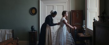 Movie still from “Lady Macbeth” (2016), directed by William Oldroyd – A woman in a dress and a woman in a dress; Medium shot, Low angle