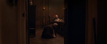 Movie still from “Lady Macbeth” (2016), directed by William Oldroyd – A man and a woman sitting at a dinner table; Wide shot, High angle