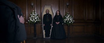 Movie still from “Lady Macbeth” (2016), directed by William Oldroyd – A man and a woman standing next to each other in a coffin; Wide shot, High angle