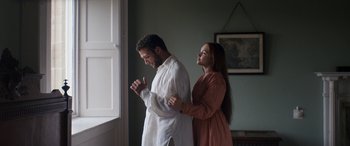 Movie still from “Lady Macbeth” (2016), directed by William Oldroyd – A man and a woman standing next to each other in a room; Medium shot, Low angle