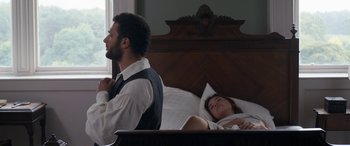 Movie still from “Lady Macbeth” (2016), directed by William Oldroyd – A man and a woman laying in a bed next to each other; Medium shot, High angle