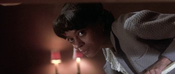 Movie still from “Lady Sings the Blues” (1972), directed by Sidney J. Furie – A person with a candle in the background; Close Up shot, Low angle