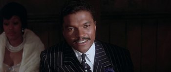Movie still from “Lady Sings the Blues” (1972), directed by Sidney J. Furie – A person wearing a suit and tie; Close Up shot, High angle