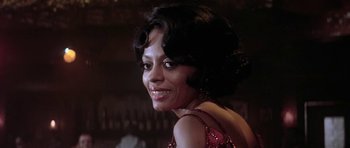 Movie still from “Lady Sings the Blues” (1972), directed by Sidney J. Furie – A person wearing a red dress; Close Up shot, Low angle