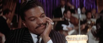 Movie still from “Lady Sings the Blues” (1972), directed by Sidney J. Furie – A man talking on the phone; Close Up shot, Over the shoulder angle