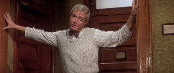 Movie still from “Lady Sings the Blues” (1972), directed by Sidney J. Furie – A man in a bow tie and a sweater vest; Medium shot, Low angle