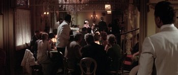 Movie still from “Lady Sings the Blues” (1972), directed by Sidney J. Furie – A group of people sitting at tables in a restaurant; Wide shot, High angle