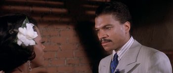 Movie still from “Lady Sings the Blues” (1972), directed by Sidney J. Furie – A person wearing a suit and tie; Close Up shot, Low angle