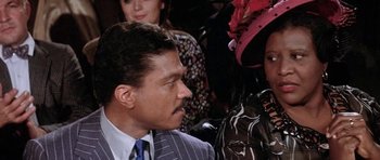 Movie still from “Lady Sings the Blues” (1972), directed by Sidney J. Furie – A man and a woman are talking to each other; Close Up shot, Over the shoulder angle