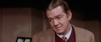 Movie still from “Lady Sings the Blues” (1972), directed by Sidney J. Furie – A person wearing a suit and tie; Close Up shot, Over the shoulder angle