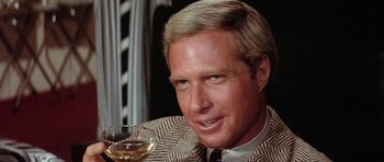 Movie still from “Lady Sings the Blues” (1972), directed by Sidney J. Furie – A person holding a glass of wine; Close Up shot, Low angle