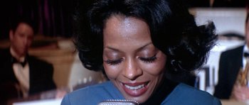 Movie still from “Lady Sings the Blues” (1972), directed by Sidney J. Furie – A person with long black hair; Close Up shot, High angle