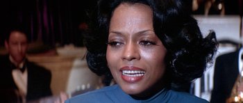 Movie still from “Lady Sings the Blues” (1972), directed by Sidney J. Furie – A woman's face with a lot of makeup on her face; Close Up shot, Over the shoulder angle