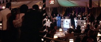 Movie still from “Lady Sings the Blues” (1972), directed by Sidney J. Furie – A group of people sitting at tables in a room; Wide shot, High angle