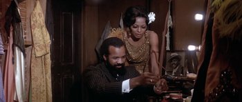 Movie still from “Lady Sings the Blues” (1972), directed by Sidney J. Furie – A man and a woman in a dressing room; Medium shot, Low angle