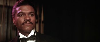 Movie still from “Lady Sings the Blues” (1972), directed by Sidney J. Furie – A person wearing a suit and tie; Close Up shot, Low angle