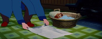 Movie still from “Lady and the Tramp” (1955), directed by Clyde Geronimi – Lady and the tramp in a basket with a sheet of toilet paper; Wide shot, High angle