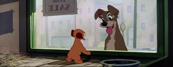 Movie still from “Lady and the Tramp” (1955), directed by Clyde Geronimi – A dog looking at a cartoon character on the sidewalk; Wide shot, Low angle