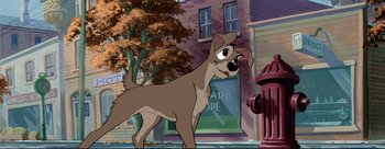 Movie still from “Lady and the Tramp” (1955), directed by Clyde Geronimi – A dog standing next to a fire hydrant in front of a building; Medium shot, Low angle