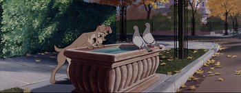 Movie still from “Lady and the Tramp” (1955), directed by Clyde Geronimi – A dog sitting in a bowl with pigeons in it; Wide shot, Low angle