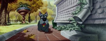Movie still from “Lady and the Tramp” (1955), directed by Clyde Geronimi – A dog is standing on a brick walkway; Wide shot, High angle
