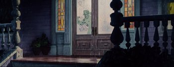 Movie still from “Lady and the Tramp” (1955), directed by Clyde Geronimi – A painting of a door way with stained - glass windows; Wide shot, Low angle