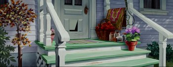 Movie still from “Lady and the Tramp” (1955), directed by Clyde Geronimi – A basket of fruit on the steps of a house; Wide shot, Low angle