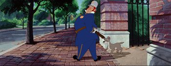 Movie still from “Lady and the Tramp” (1955), directed by Clyde Geronimi – A man in a blue uniform and a white hat is walking with a dog; Medium shot, Low angle