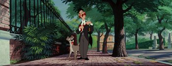 Movie still from “Lady and the Tramp” (1955), directed by Clyde Geronimi – A man and a dog standing next to each other on a sidewalk; Wide shot, Low angle