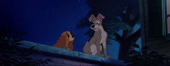 Movie still from “Lady and the Tramp” (1955), directed by Clyde Geronimi – Lady and the tramp sitting next to each other on a wall; Wide shot, Low angle