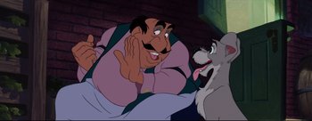 Movie still from “Lady and the Tramp” (1955), directed by Clyde Geronimi – A cartoon character with a dog; Medium shot, Over the shoulder angle