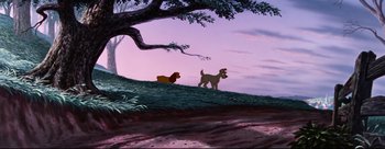 Movie still from “Lady and the Tramp” (1955), directed by Clyde Geronimi – Two dogs are standing on a hill near a tree; Wide shot, Low angle
