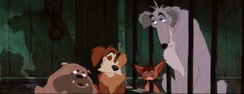 Movie still from “Lady and the Tramp” (1955), directed by Clyde Geronimi – A group of cartoon dogs sitting next to each other; Medium shot, Low angle