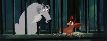 Movie still from “Lady and the Tramp” (1955), directed by Clyde Geronimi – A couple of dogs sitting next to each other on top of a floor; Medium shot, Low angle