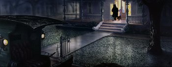 Movie still from “Lady and the Tramp” (1955), directed by Clyde Geronimi – A person standing on the steps of a house; Extreme Wide shot, High angle