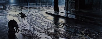 Movie still from “Lady and the Tramp” (1955), directed by Clyde Geronimi – A wet street with a puddle of water on the ground; Extreme Wide shot, High angle