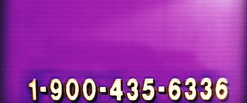 Movie still from “We the Animals” (2018), directed by Jeremiah Zagar – A phone number on a purple background; Extreme Close Up shot, Low angle